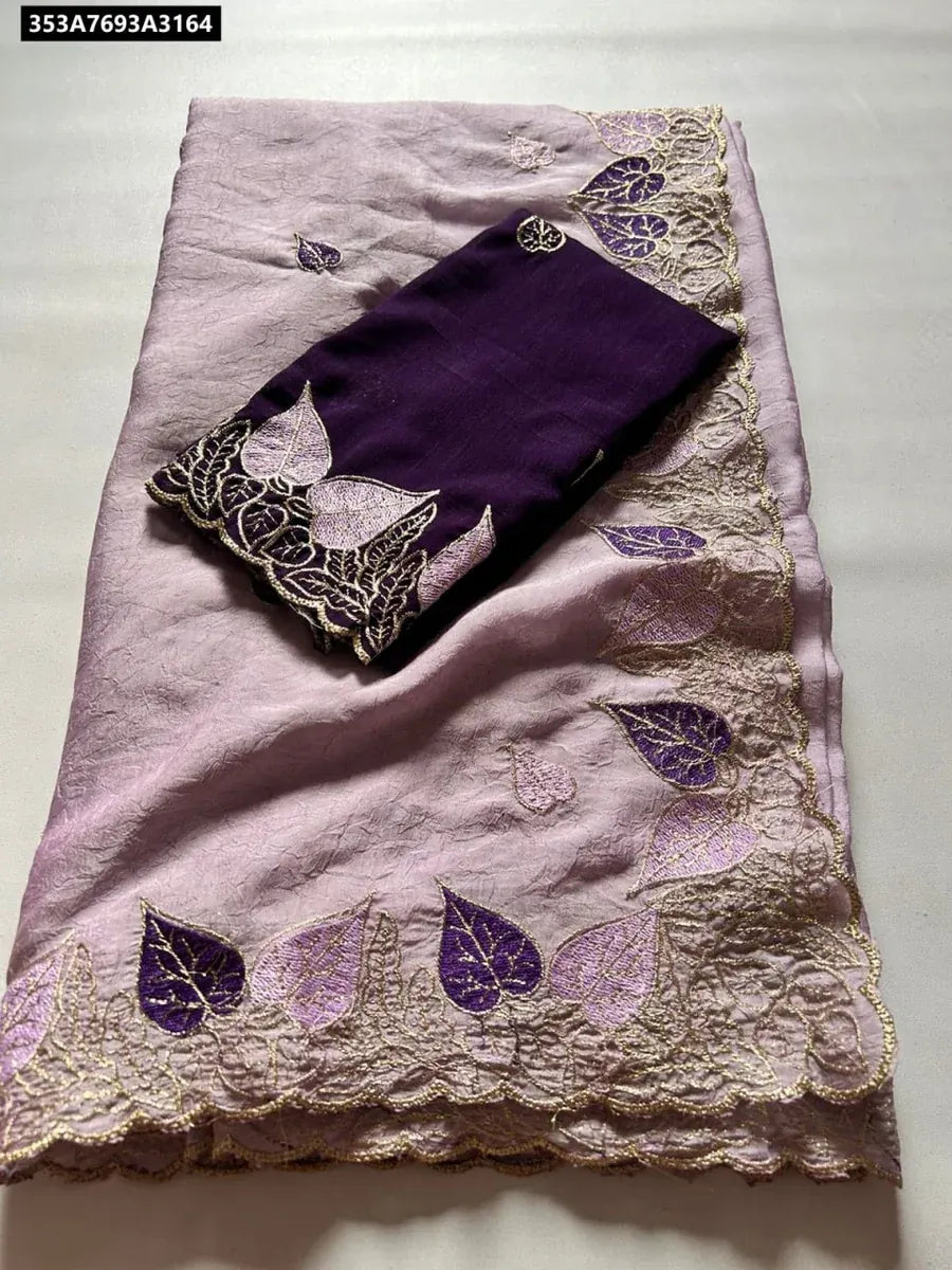 TRENDBUY Rangoli Crush Silk Saree with embroidery and cut work border in Lavender, with a dark purple contrast blouse piece, flat lay.