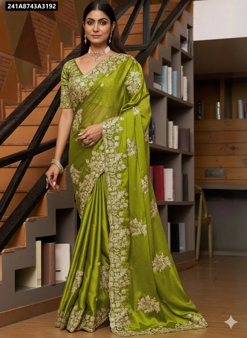 Model in lime green Rangoli silk saree with intricate embroidery and cut work border, showcasing traditional Indian attire.