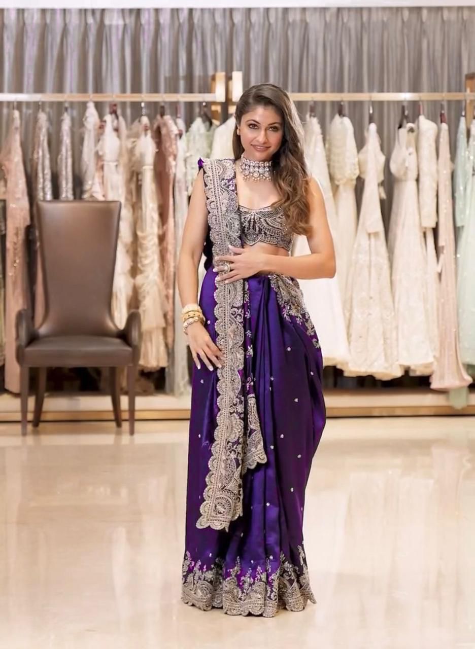 Model wearing a Lavender Rangoli Silk Saree with heavy gold sequence embroidery and a matching blouse, exuding elegance.