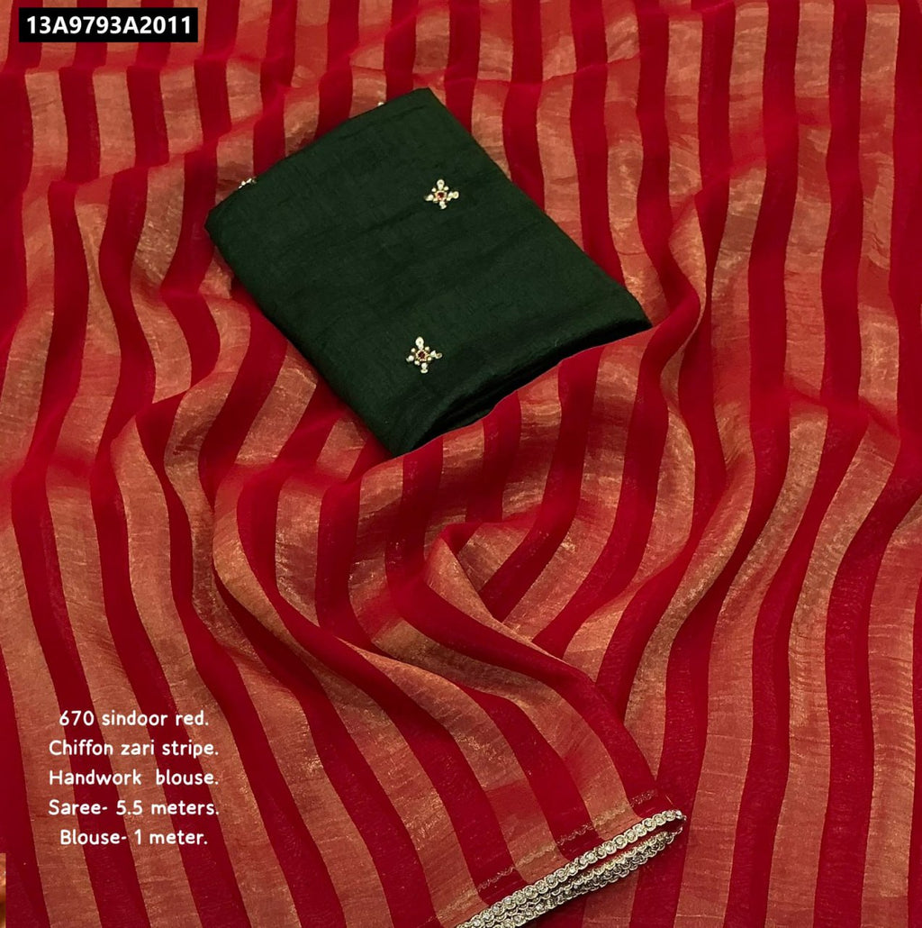 TRENDBUY Red Chiffon Saree with zari stripes and stonework lace, draped with a contrast Dark Green handwork blouse.