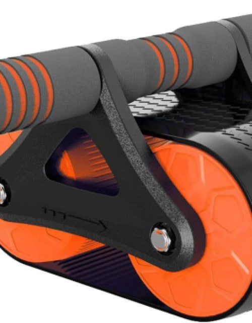 Person using a roller wheel ab exerciser with pivot brake to strengthen abs.