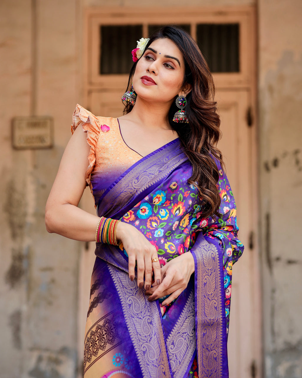 Profile view of woman showcasing the intricate digital print and traditional Zari weaving on the Royal Blue silk saree.