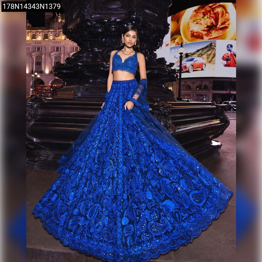 Model wearing Royal Blue Faux Georgette Sequin Lehenga Choli, front view