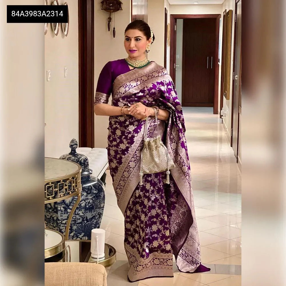 Model wearing Royal Purple Lichi Silk Saree with heavy jacquard work and contrast brocade blouse, full view in an elegant setting.