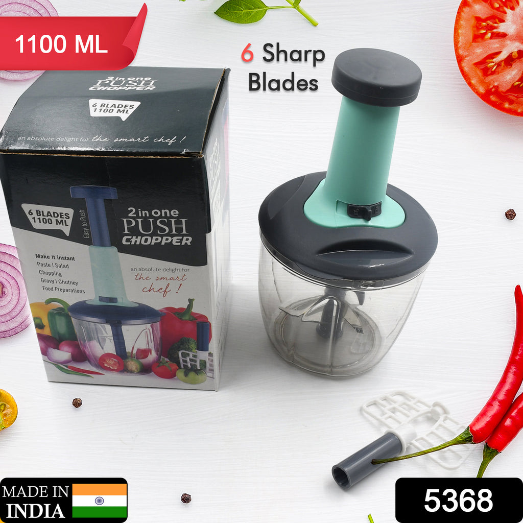 Easy push and chop 1100ml vegetable fruit chopper with 6 sharp blades in action, cutting vegetables.