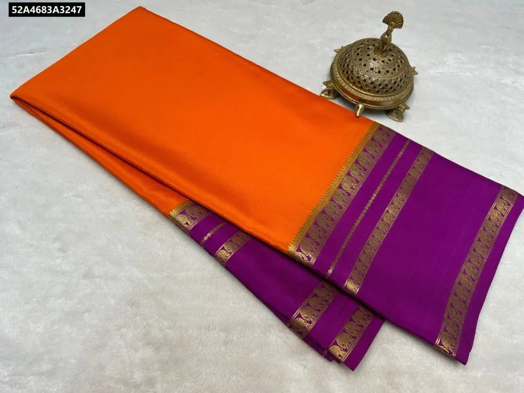TRENDBUY Semi Crepe Mysore Silk Saree - Orange with Purple border and pallu, flat lay.