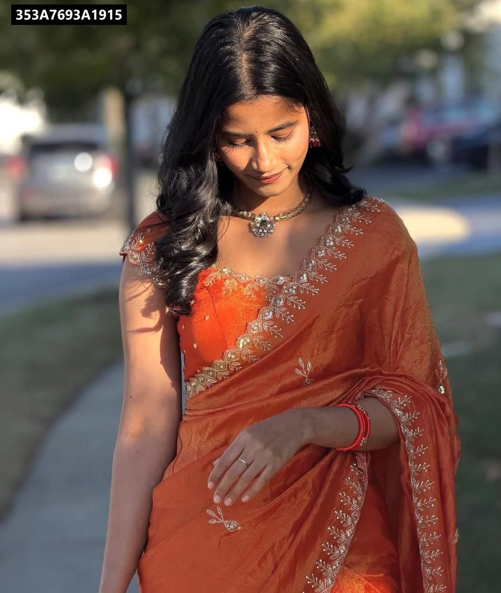Model wearing Crunchy Chiffon Crush Silk Saree with orange blouse and sequence work