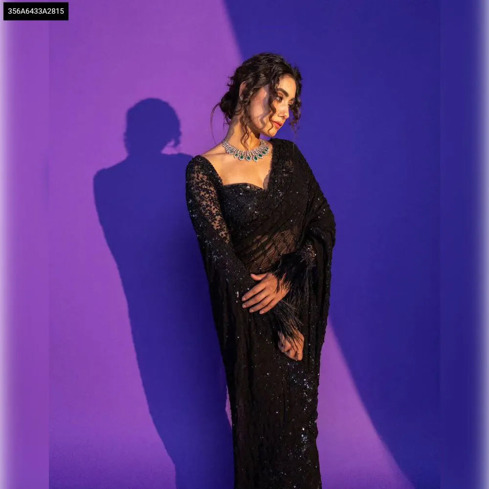 TRENDBUY Black Sequin Embroidered Net Saree with feather details, modelled
