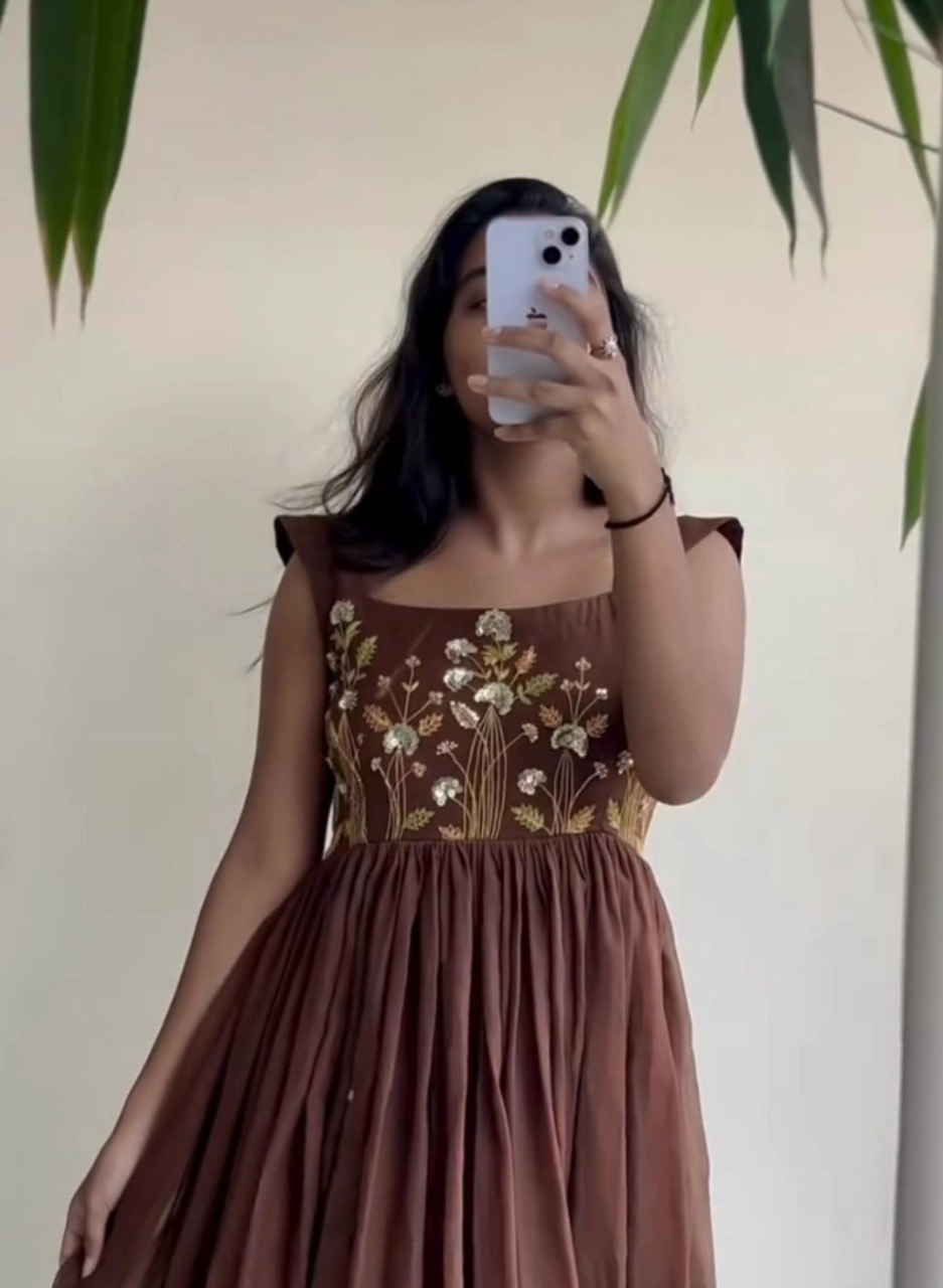 Woman posing in a stunning Cocoa Brown sequined Georgette maxi dress by TRENDBUY