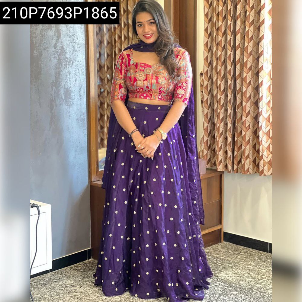 Model wearing purple sequins embroidered lehenga set with multi-color blouse, front view.