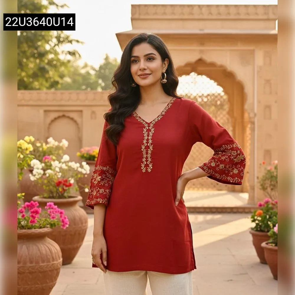 Model in a Rust Embroidered Rayon Short Kurti, front facing, outdoor setting.