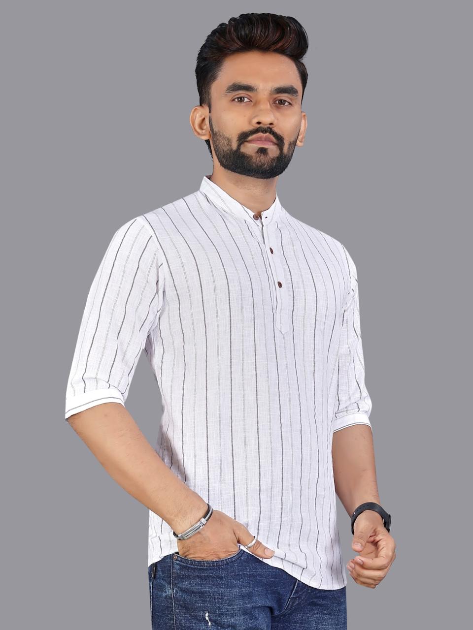Man in white striped linen short kurta with grey stripes, standing elegantly.