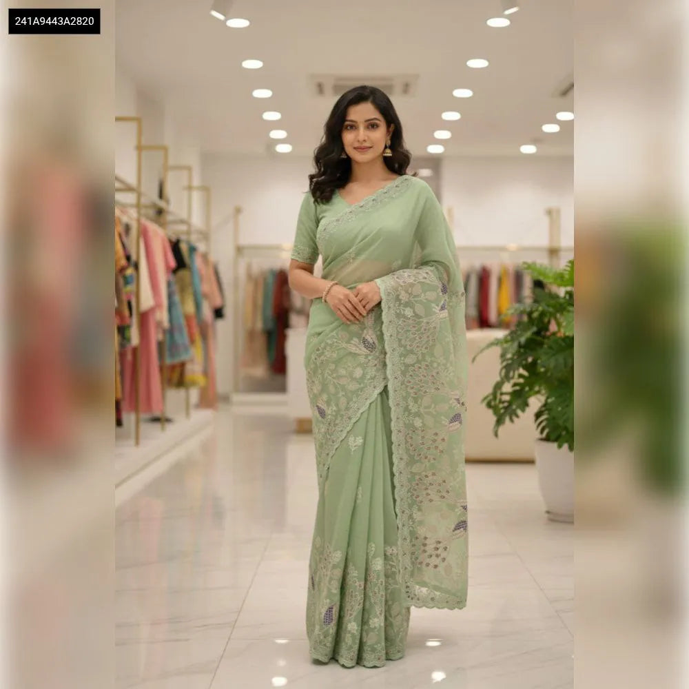 TRENDBUY Soft Crunchy Silk Saree in Mint Green with embroidery and cut work border, modeled front facing.