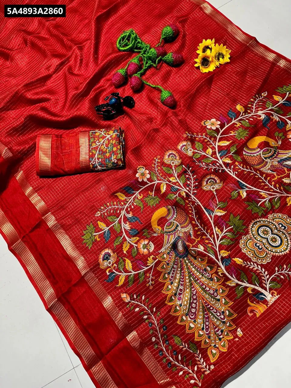 Red Dola Silk Saree with Pen Kalamkari design and Zari Hamsa border, styled flat lay