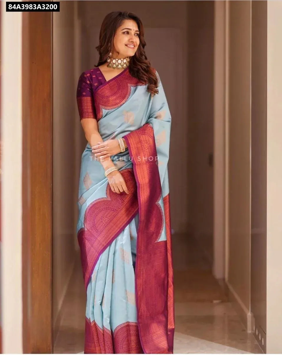 Full body shot of model wearing Sky Blue Soft Lichi Silk Saree with Plum pallu and blouse, front facing.