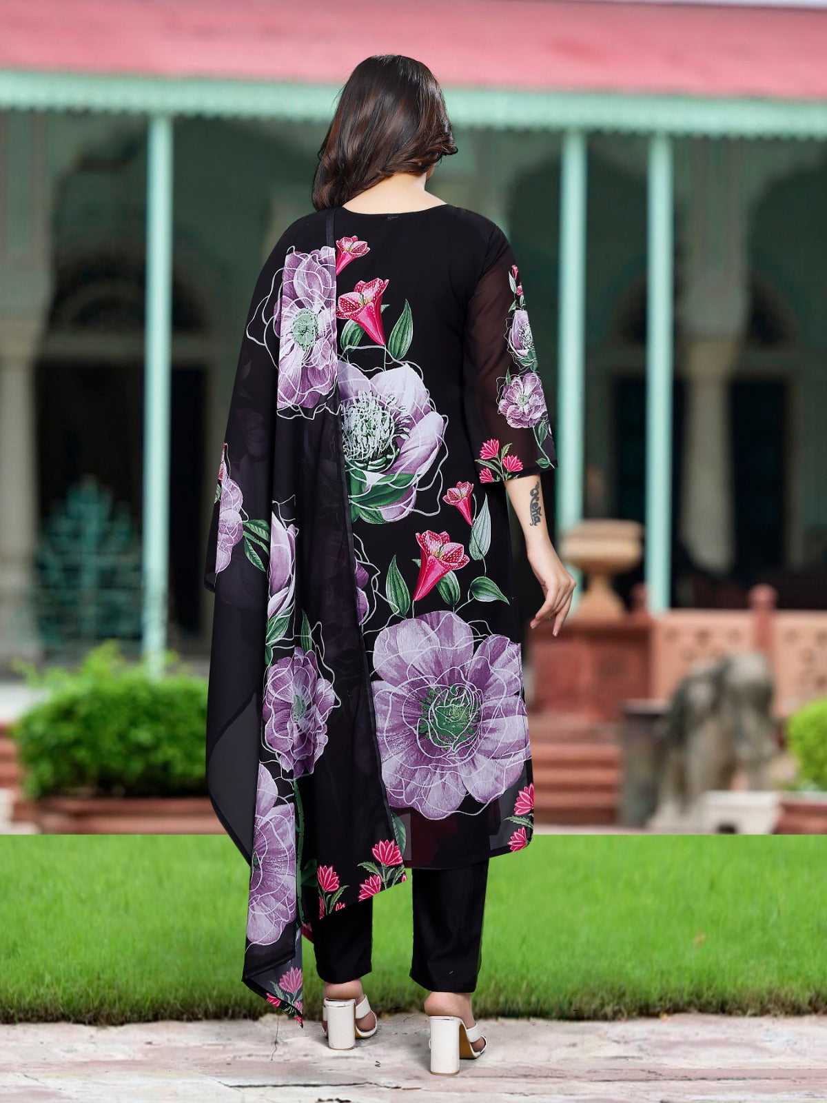 Rear view of the TRENDBUY Sonika black Georgette kurta set, showcasing the large purple and pink floral print.