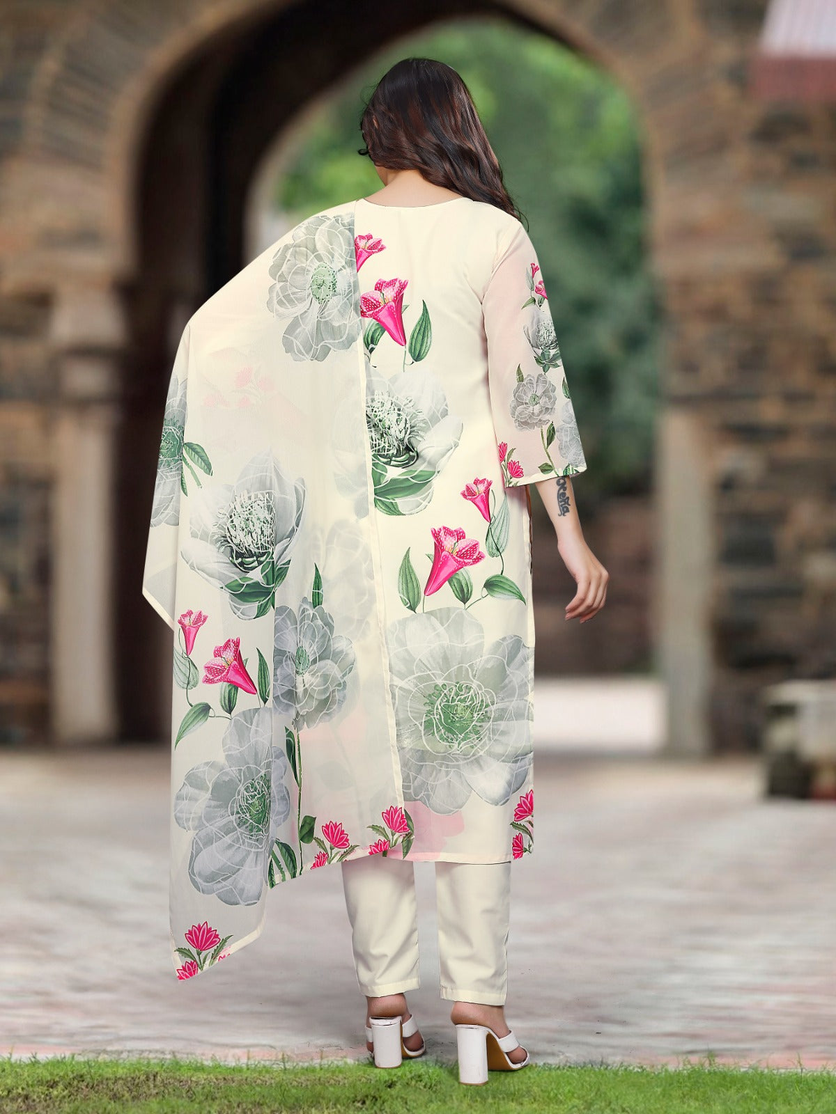 Rear view of the TRENDBUY Sonika white Georgette kurta set, highlighting the soft floral design on the back.