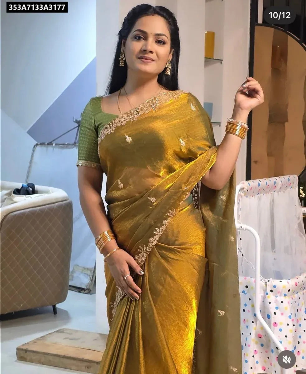 Model wearing TRENDBUY Golden Mustard Space Chiffon Saree with dark green embroidered blouse, front pose