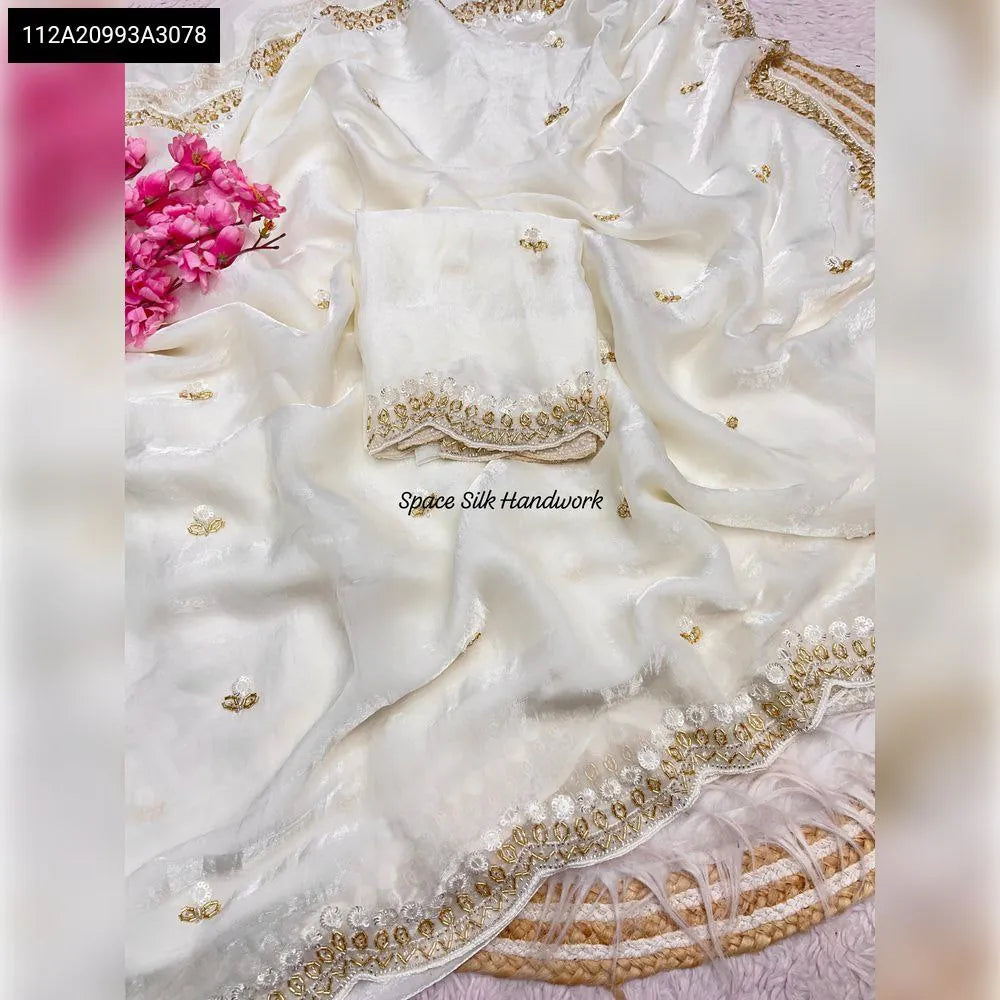 TRENDBUY White Space Silk Saree with handwork and running blouse on a furry background.