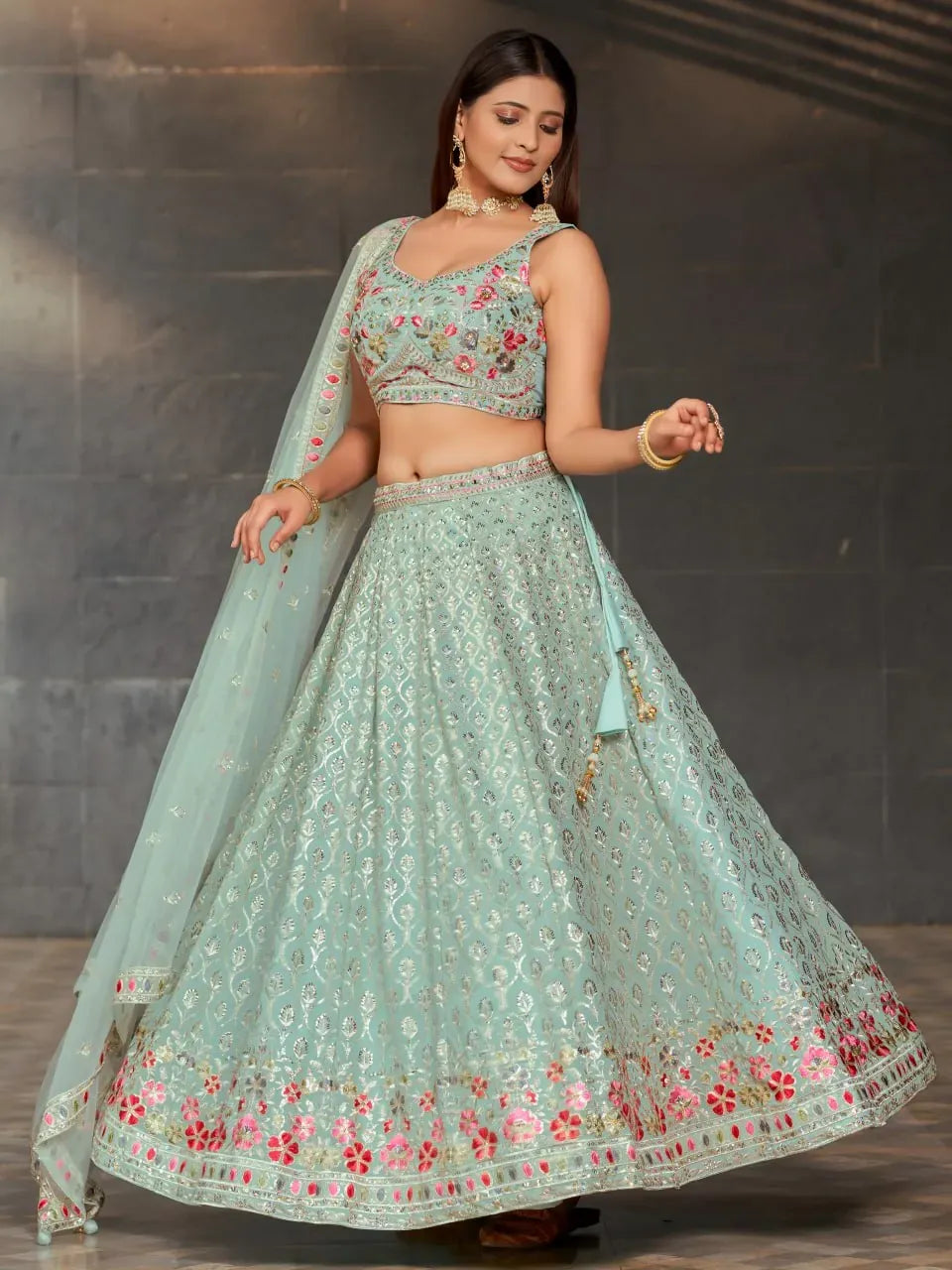 Model wearing pastel sky blue sequin embroidered georgette lehenga front view