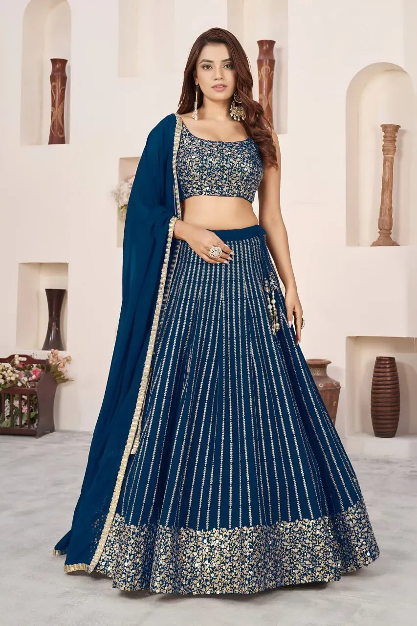 Stunning blue sequins lehenga choli front view on model with matching dupatta