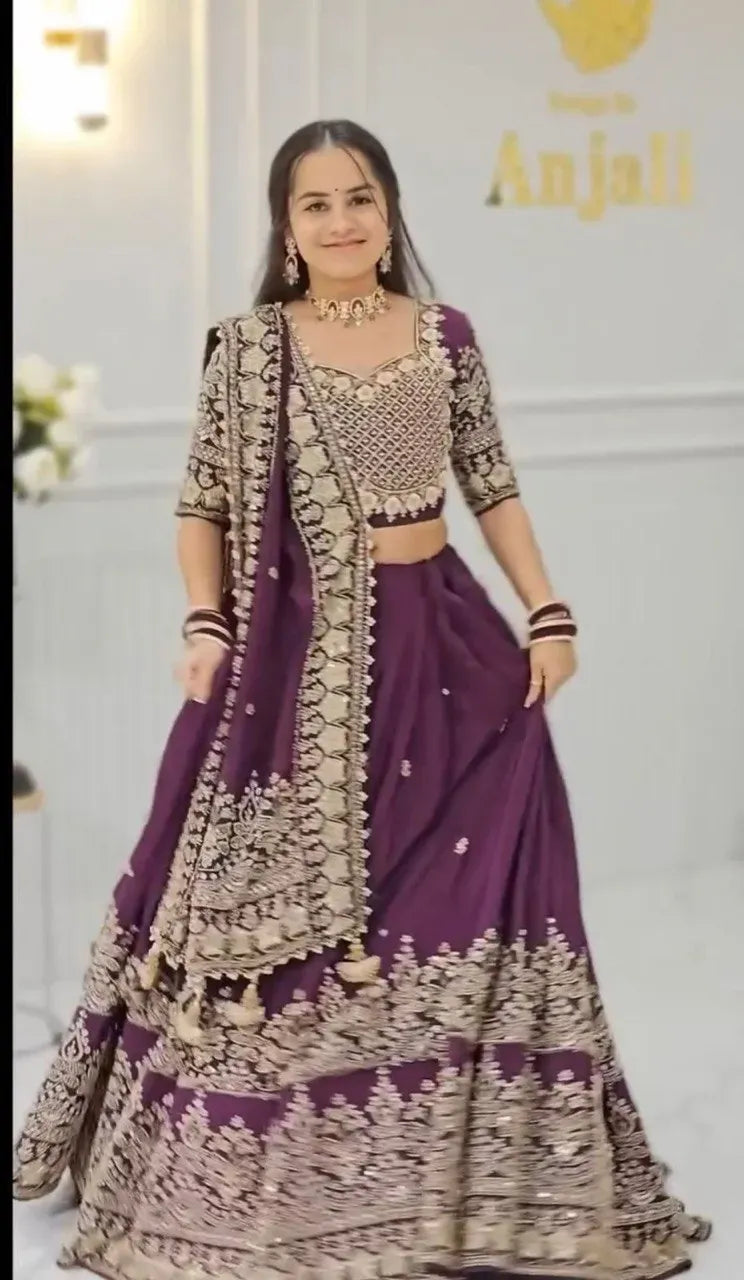 Model smiling in a gorgeous purple Chinon lehenga with heavy embroidery showcasing the full length and flair