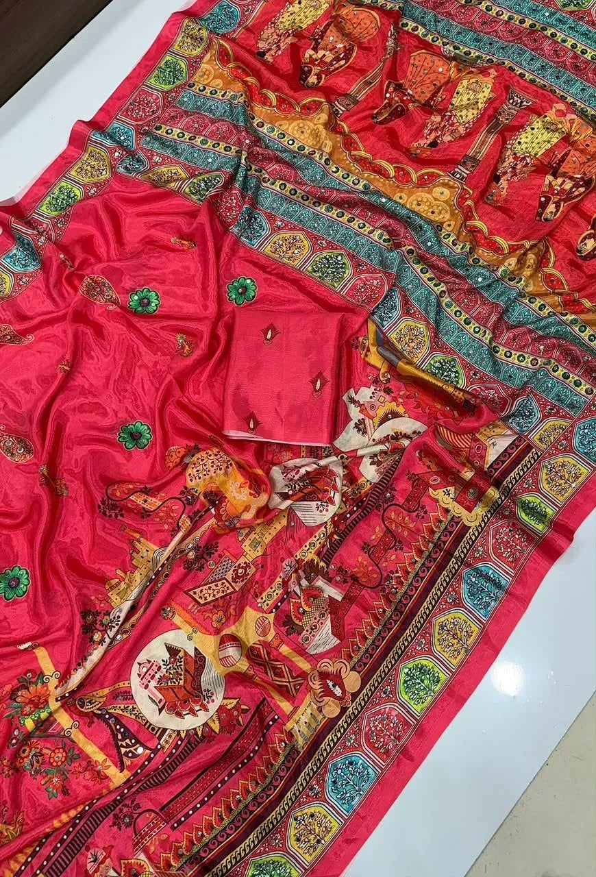 Rani pink chinon saree laid flat displaying colorful digital prints and mirror work with matching blouse piece