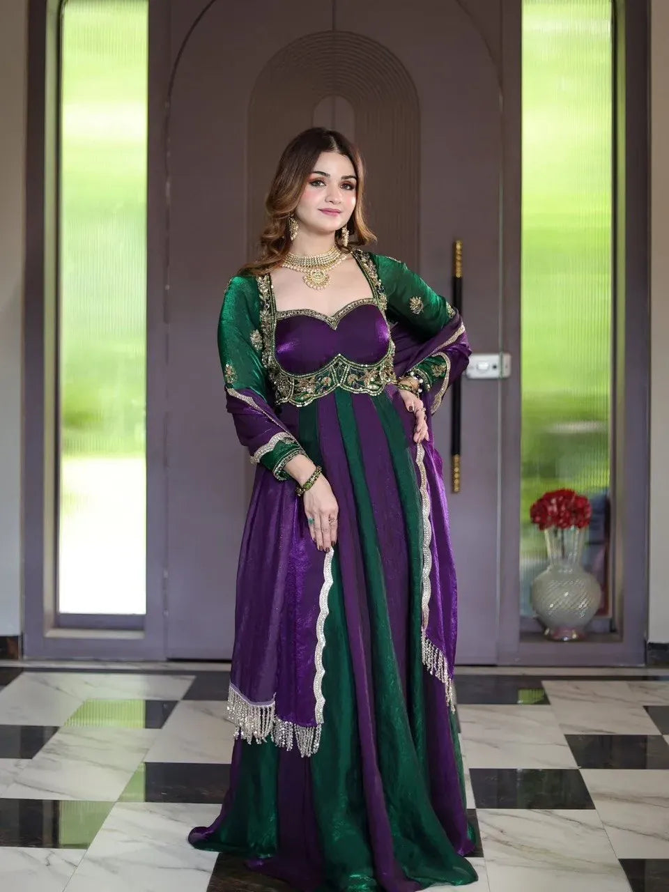Front-facing full-body shot of model wearing purple and green embroidered fendy silk gown