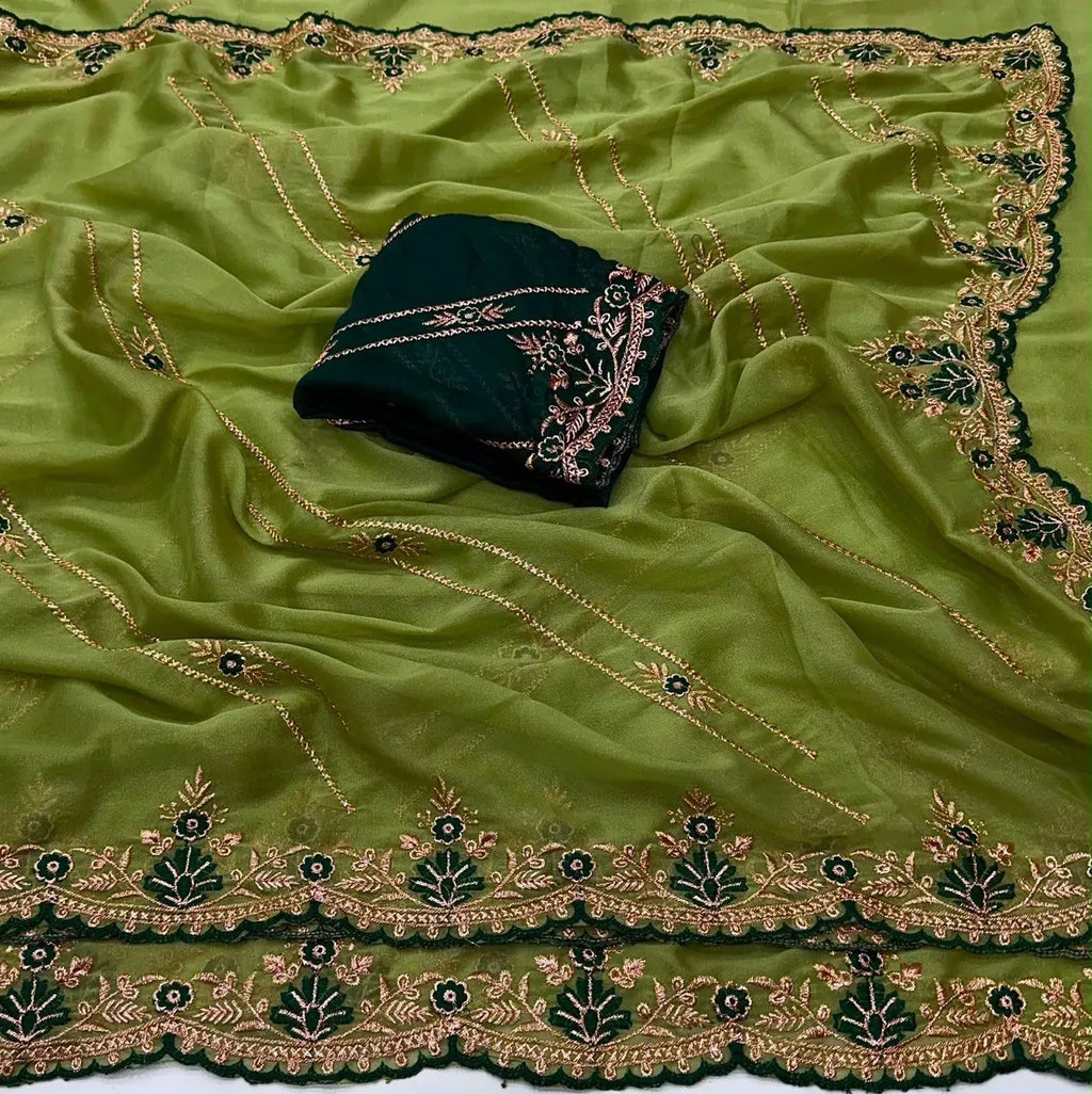 Lime green georgette saree with intricate dark green and gold embroidered borders and matching contrast blouse