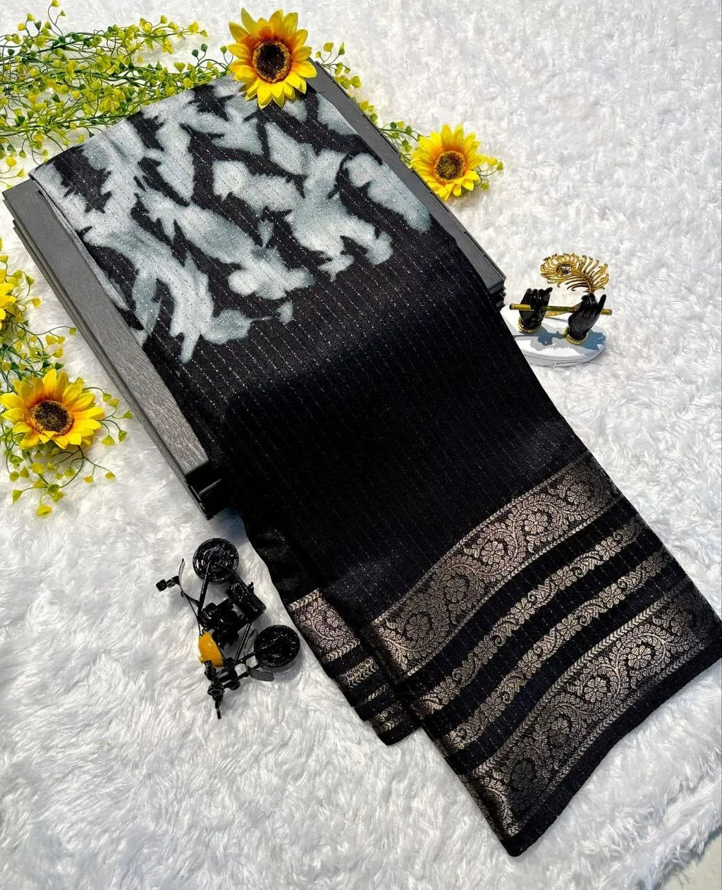 Black georgette saree with silver abstract print and gold zari border