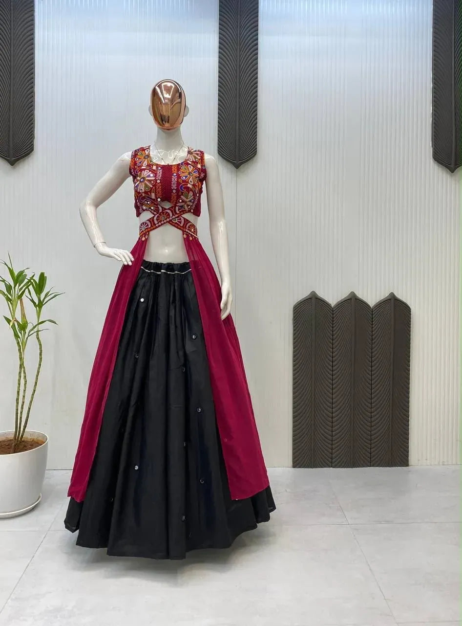 Mannequin displaying a maroon embroidered crop top with a long cape and a black cotton lehenga skirt