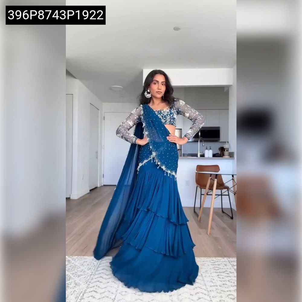 Model wearing Teal Blue Faux Georgette Ruffled Lehenga Saree with thread and sequence work, full body front view.