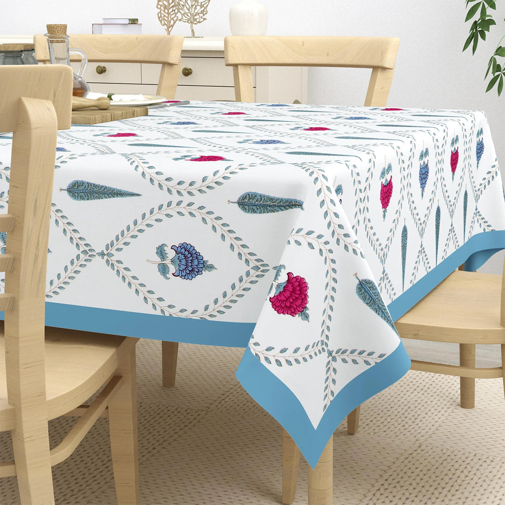 White canvas dining table cover with blue and pink floral block print on 6 seater table