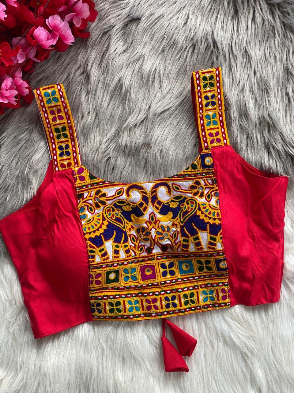 Red traditional embroidered sleeveless blouse for women with elephant motif and mirror work