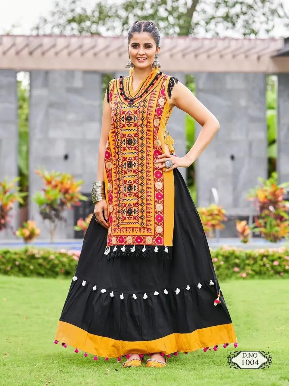 Model wearing yellow embroidered panel skirt front view outdoors
