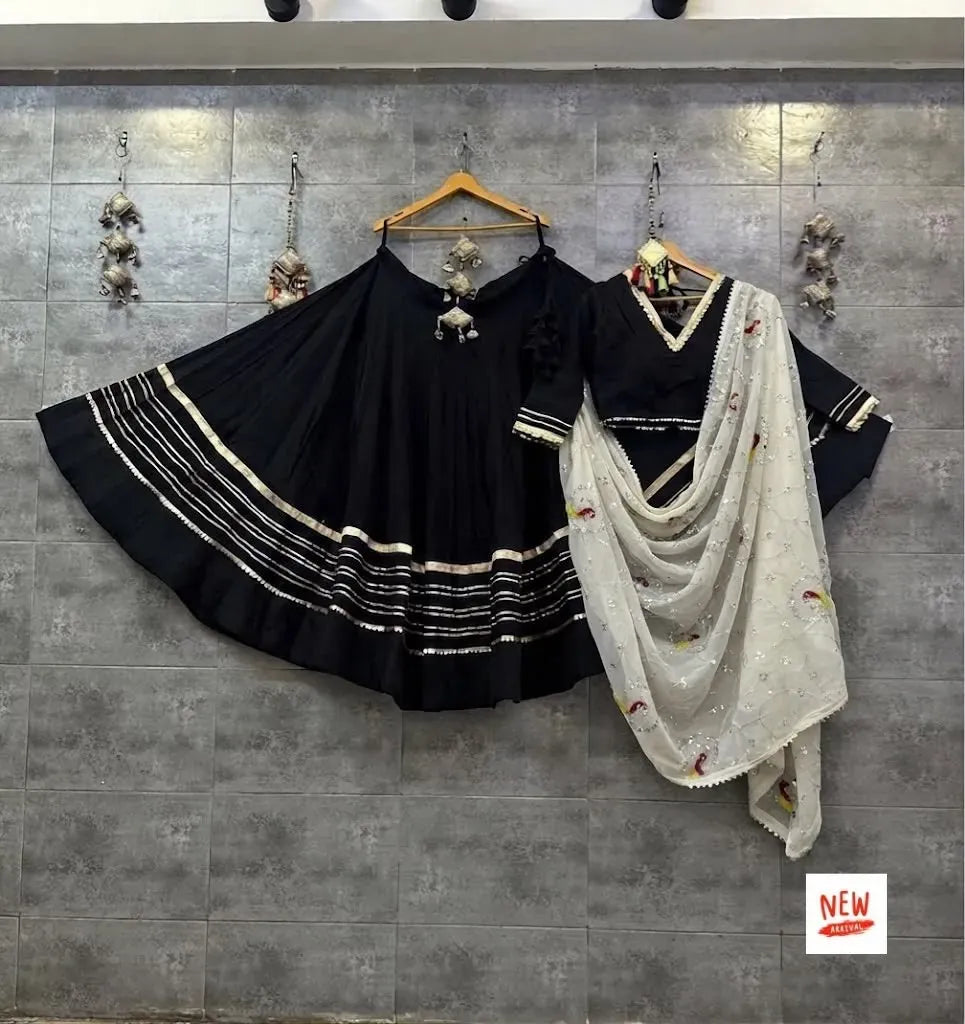 Black rayon cotton lehenga choli with silver gotta work and a contrast white embroidered georgette dupatta
