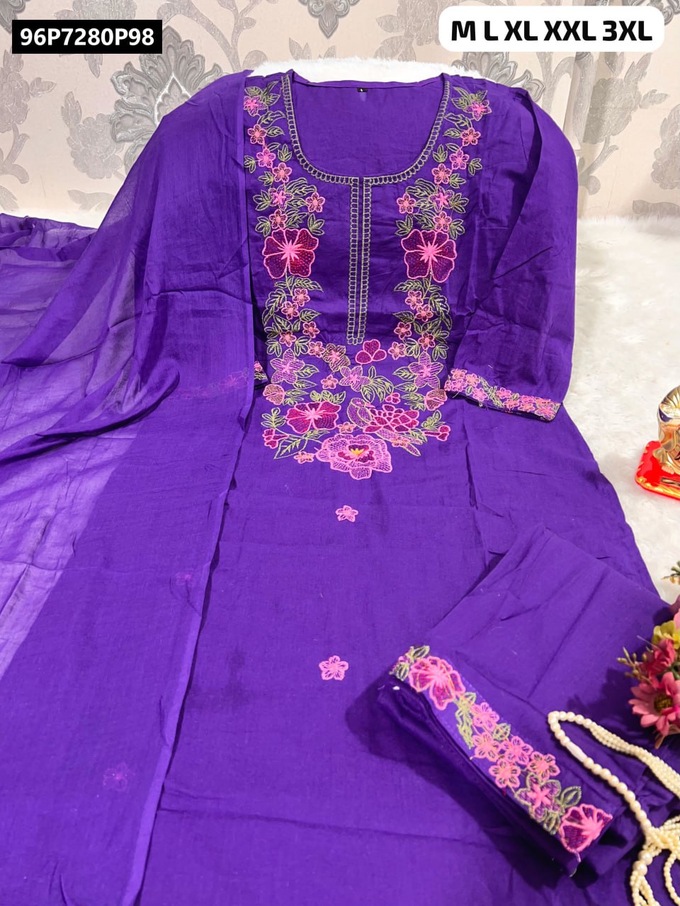 TRENDBUY Purple A-Line Cotton Kurti Set with intricate pink floral hand embroidery, matching pant, and dupatta, laid flat.