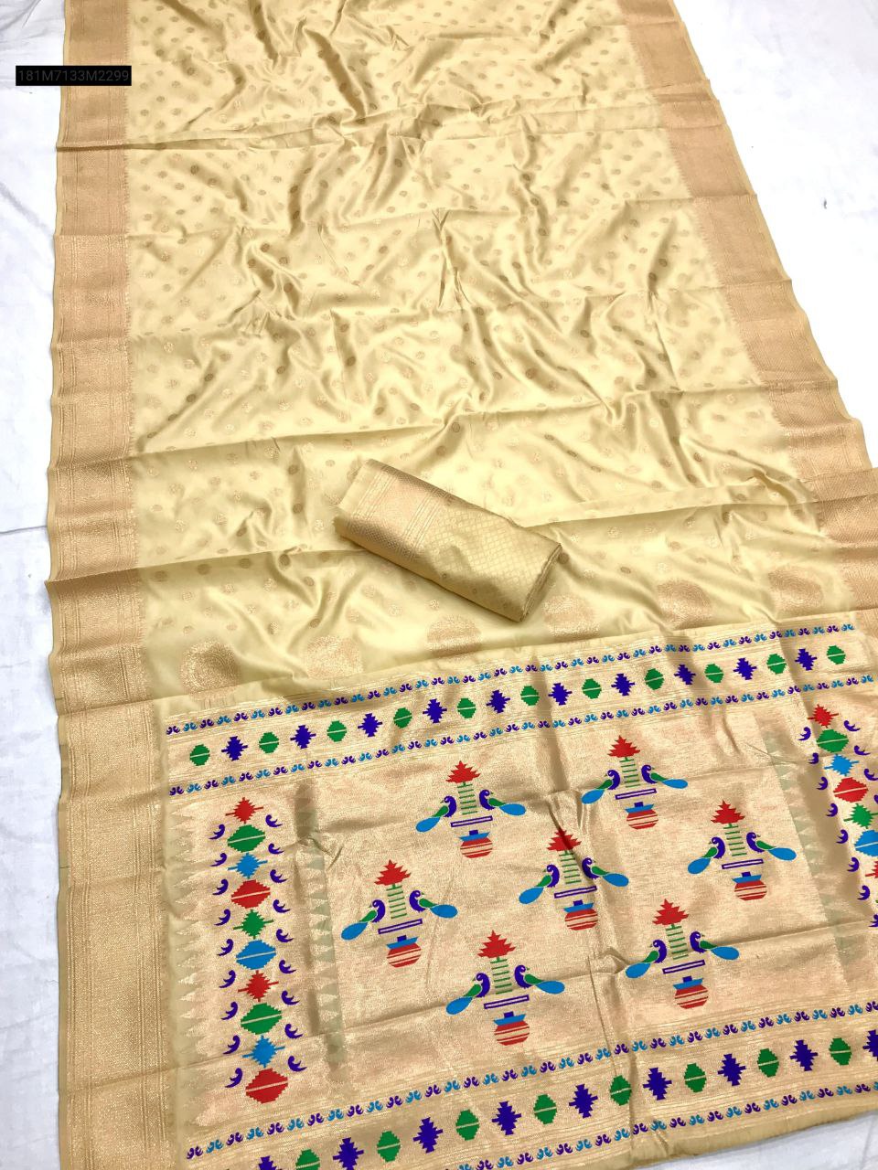 TRENDBUY Cream Banarasi Lichi Silk Paithani saree with traditional copper zari weaving and ornate peacock pallu.