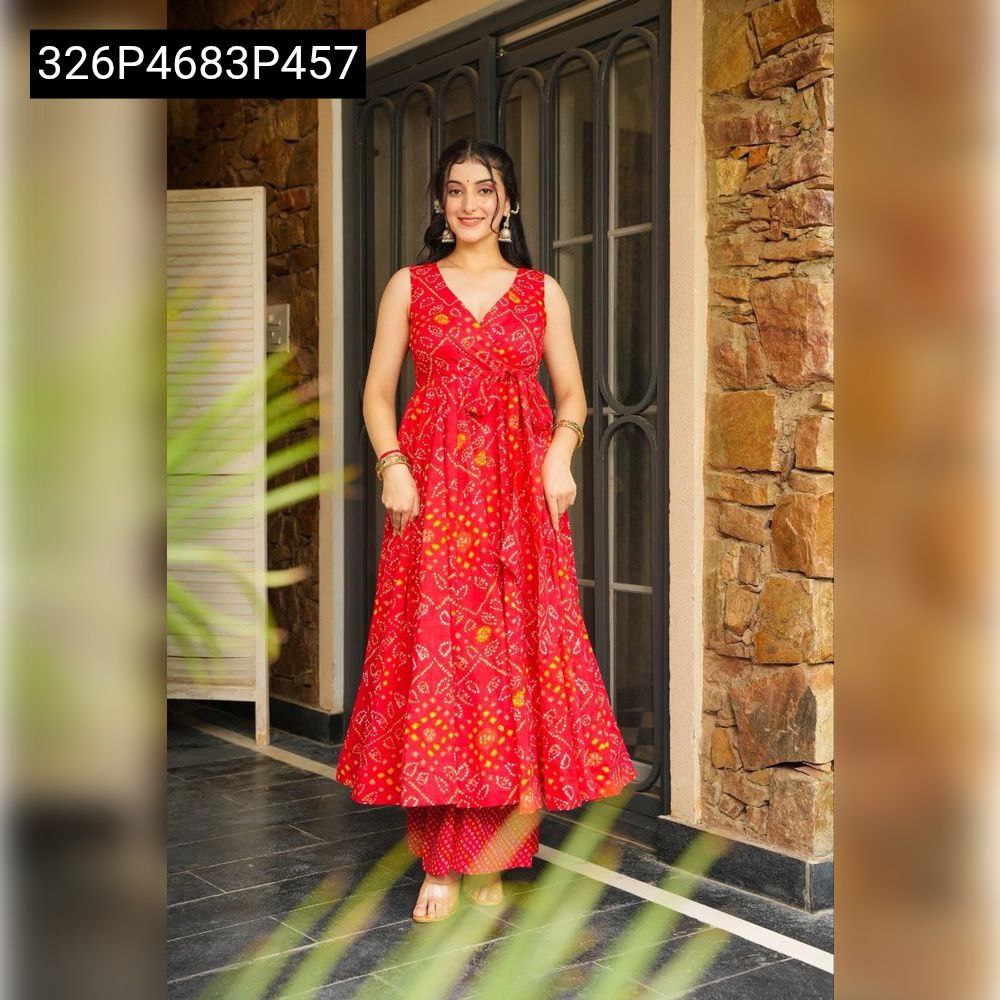 Full body front view of a smiling model wearing a TRENDBUY red Bandhani swirl cotton kurta and palazzo set, perfect for festive events.