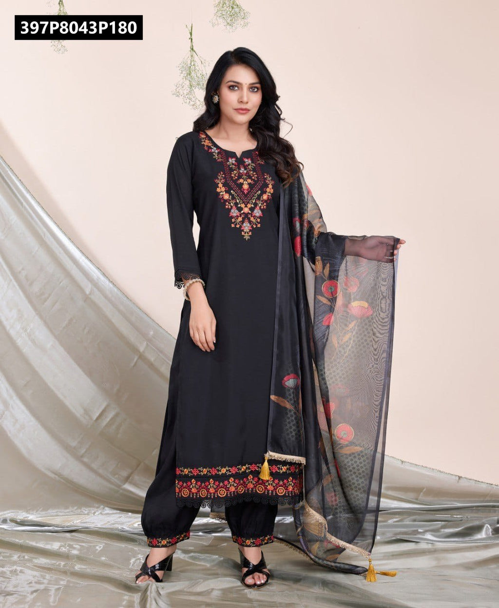 Full body shot of a model gracefully posing in the TRENDBUY black embroidered viscose silk kurta set with a sheer organza dupatta, showcasing the complete outfit.