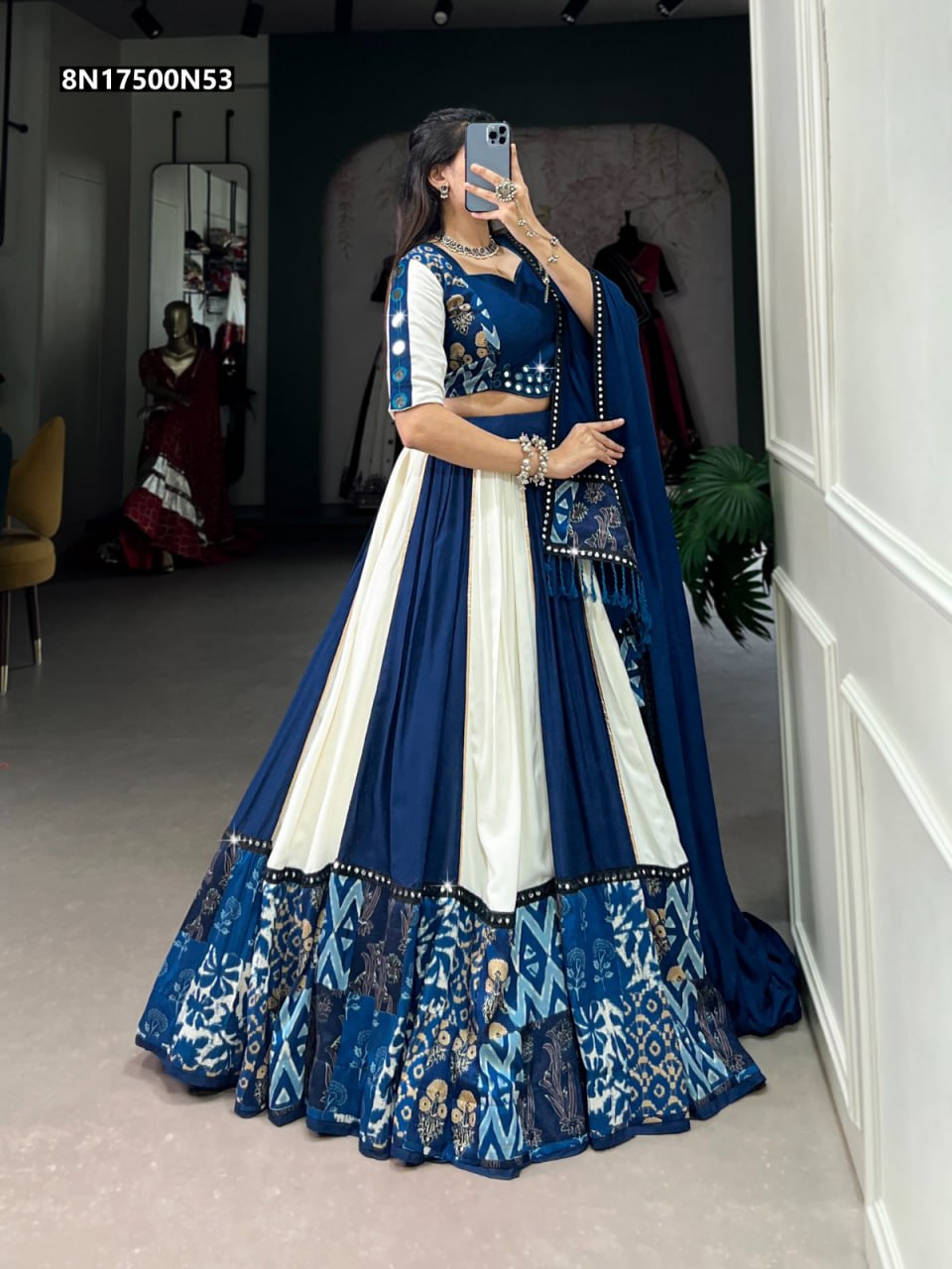 Full body front-side view of a model gracefully presenting the TRENDBUY Blue & White Rayon Lehenga Choli, emphasizing its vibrant colors and ethnic patterns.