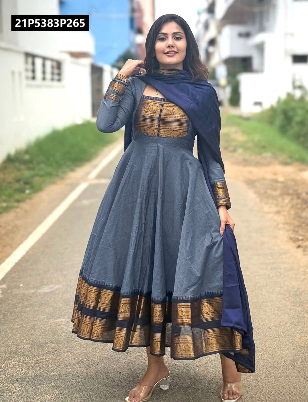 Model showcasing TRENDBUY gray chanderi cotton Anarkali kurta set with dark blue dupatta, elegant jacquard zari patterns, full length view on a street.