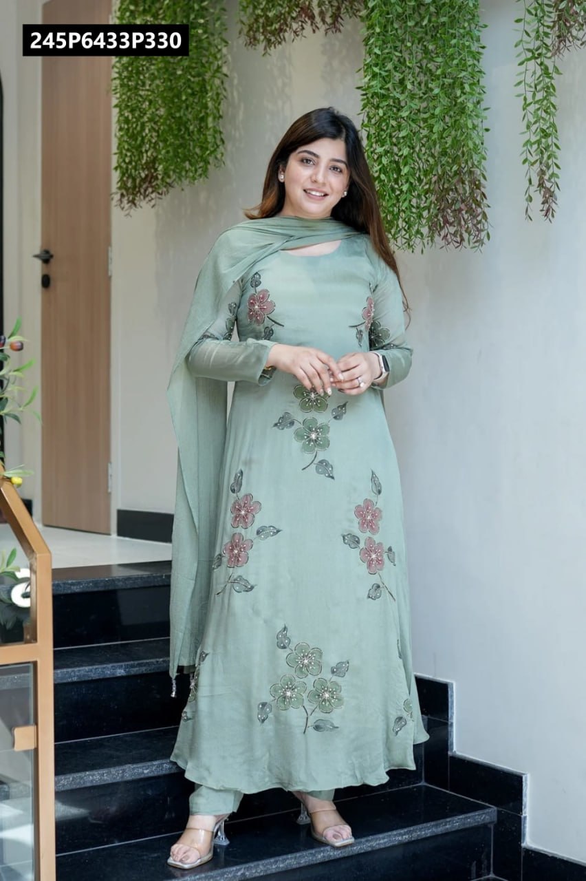Model posing confidently on stairs in a Seafoam Green Chinnon kurta set, showcasing the full length and delicate floral embroidery.