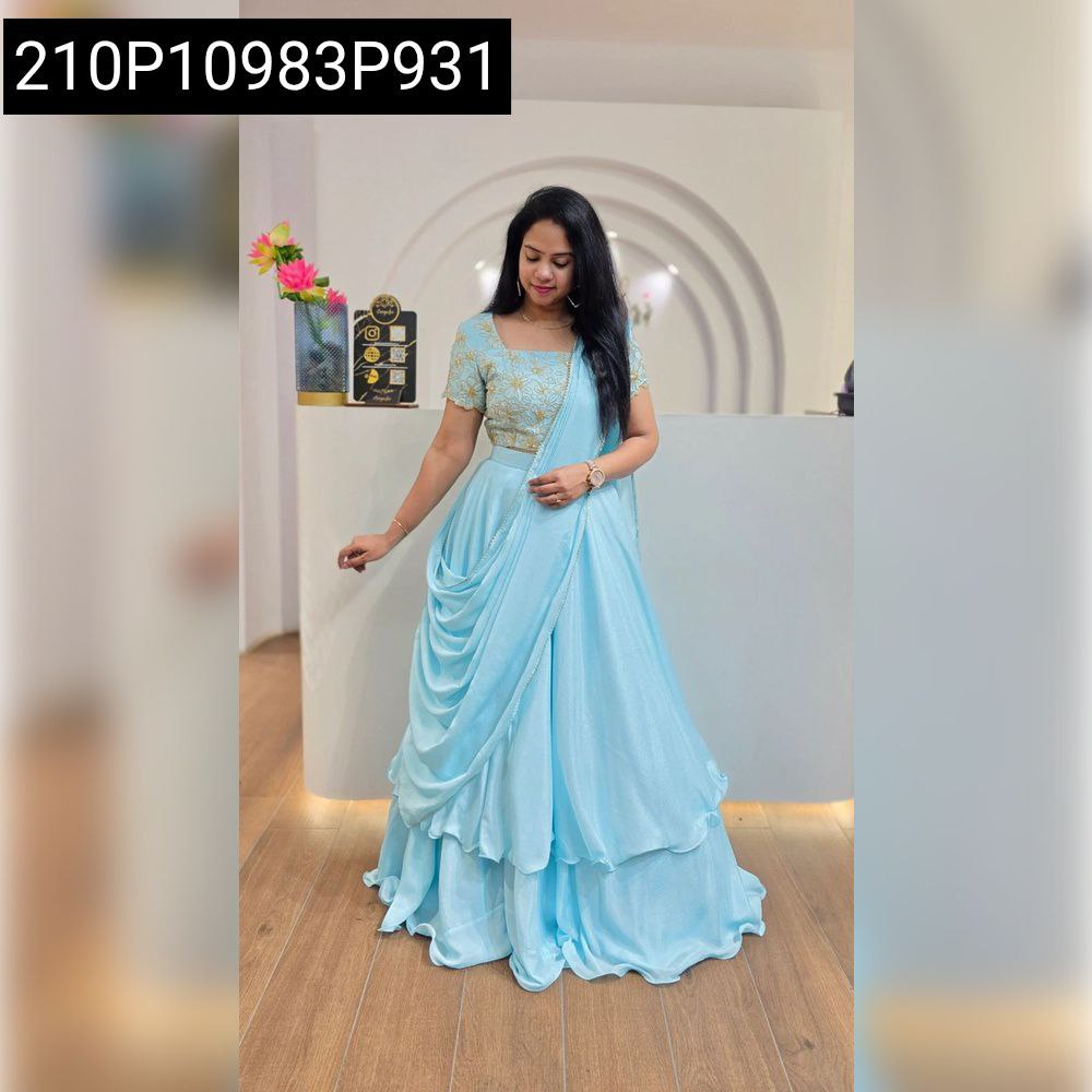 Model in TRENDBUY light blue Chinon Silk lehenga gown set with sequins embroidery, full body shot, posing elegantly in a minimalist setting.