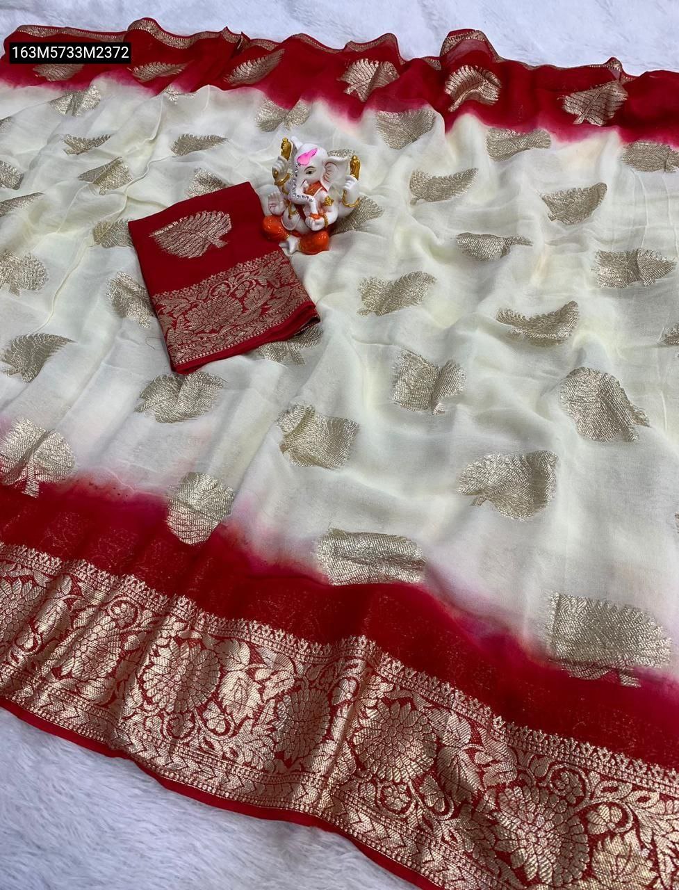 TRENDBUY Cream & Red Pure Viscose Georgette saree with gold Jari weaving border and running blouse piece, elegantly displayed on a white surface next to a small Ganesha idol.