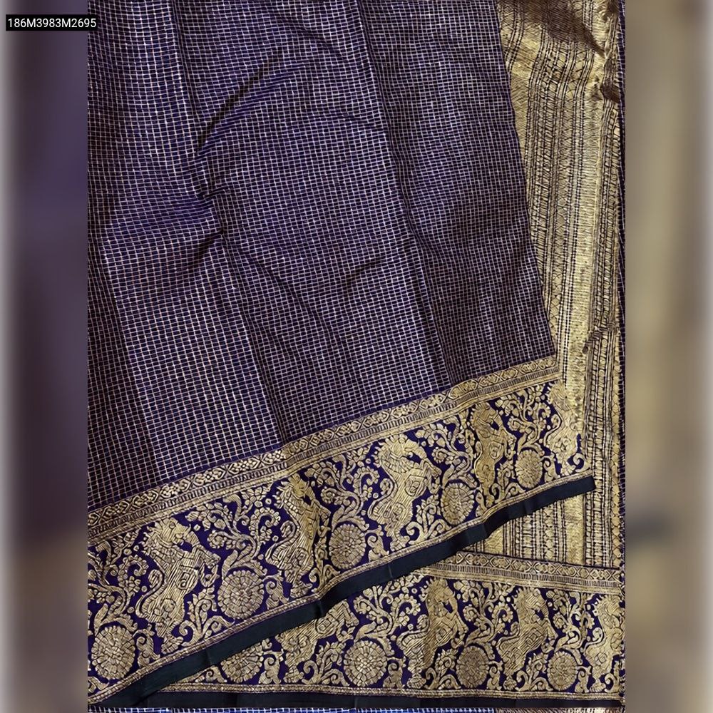 Close-up of TRENDBUY Deep Purple Banarasi Soft Silk Saree showing intricate gold Zari grid pattern and ornate traditional border motifs.