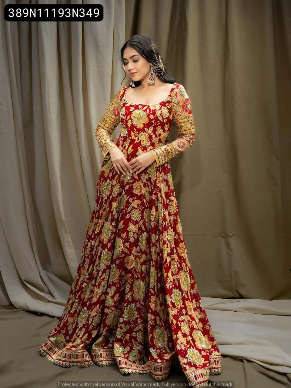 Full-body model shot of a woman elegantly posing in the TRENDBUY maroon embroidered floral Chinon silk gown with net dupatta.
