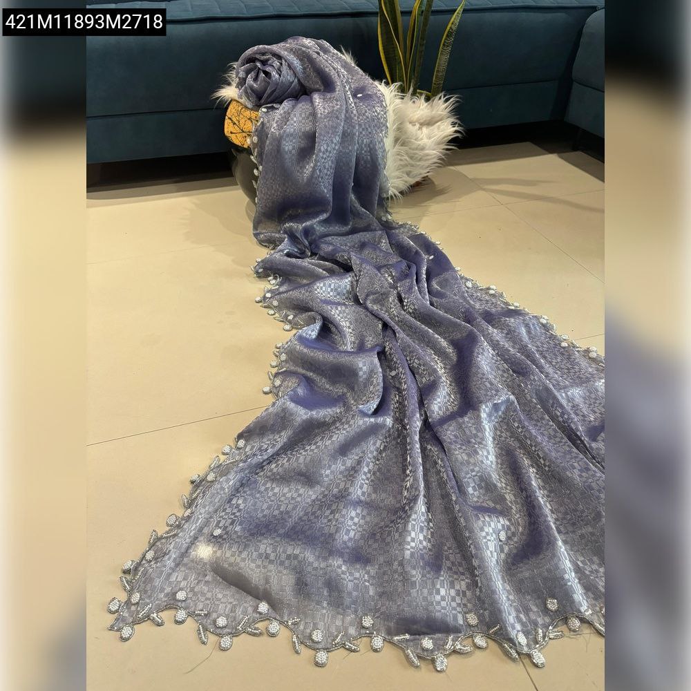 TRENDBUY Lavender Silk Blend Saree with self-weave pattern and intricate moti-cut dana cutwork border, elegantly draped.