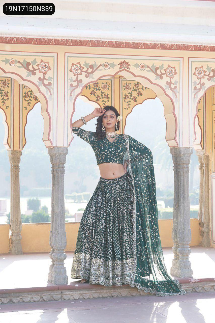 TRENDBUY green viscose jacquard lehenga choli set with gold sequins embroidery, modeled elegantly against a traditional archway.