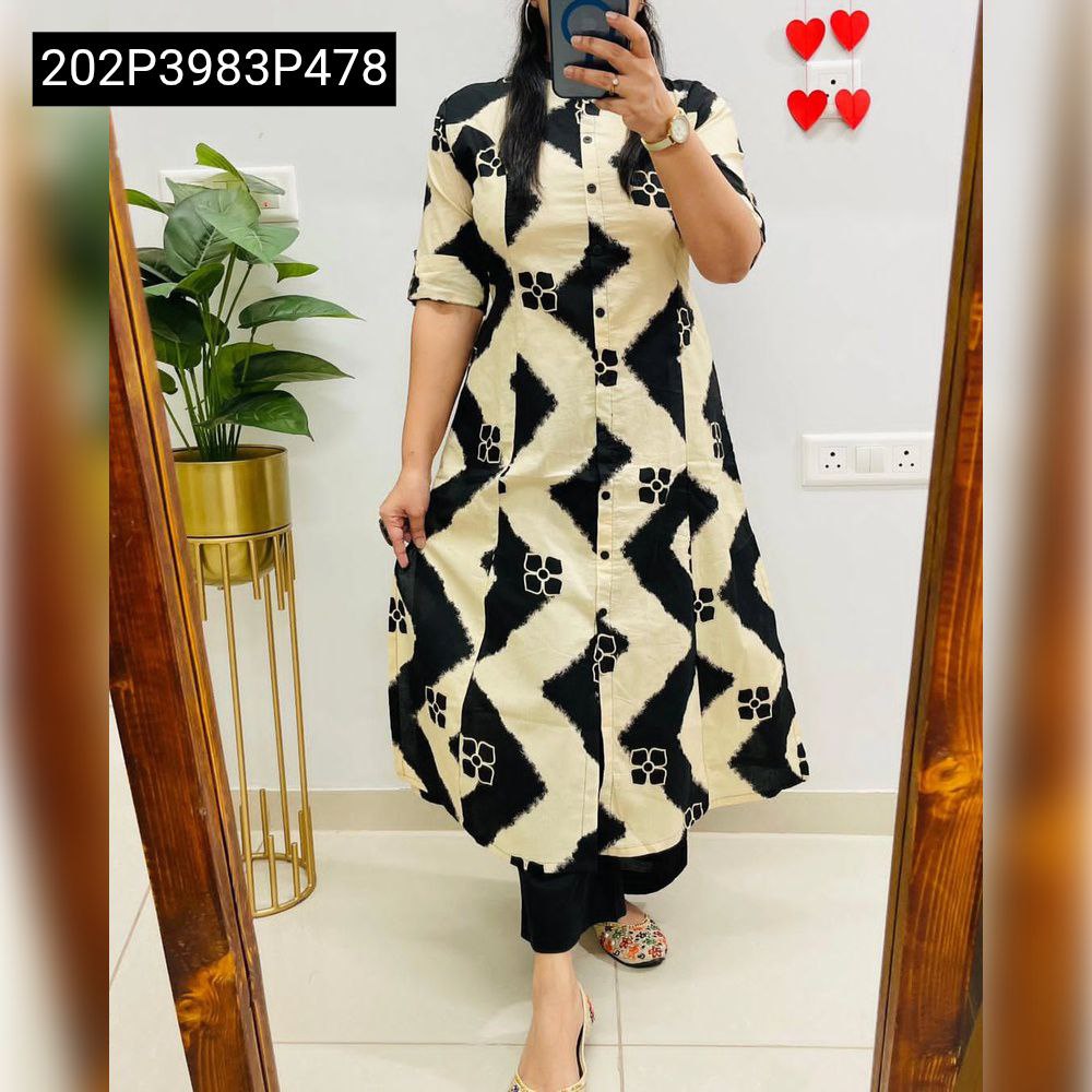 Full body shot of a woman wearing a TRENDBUY black and beige digital print A-line soft reyon kurti with black ankle pants.